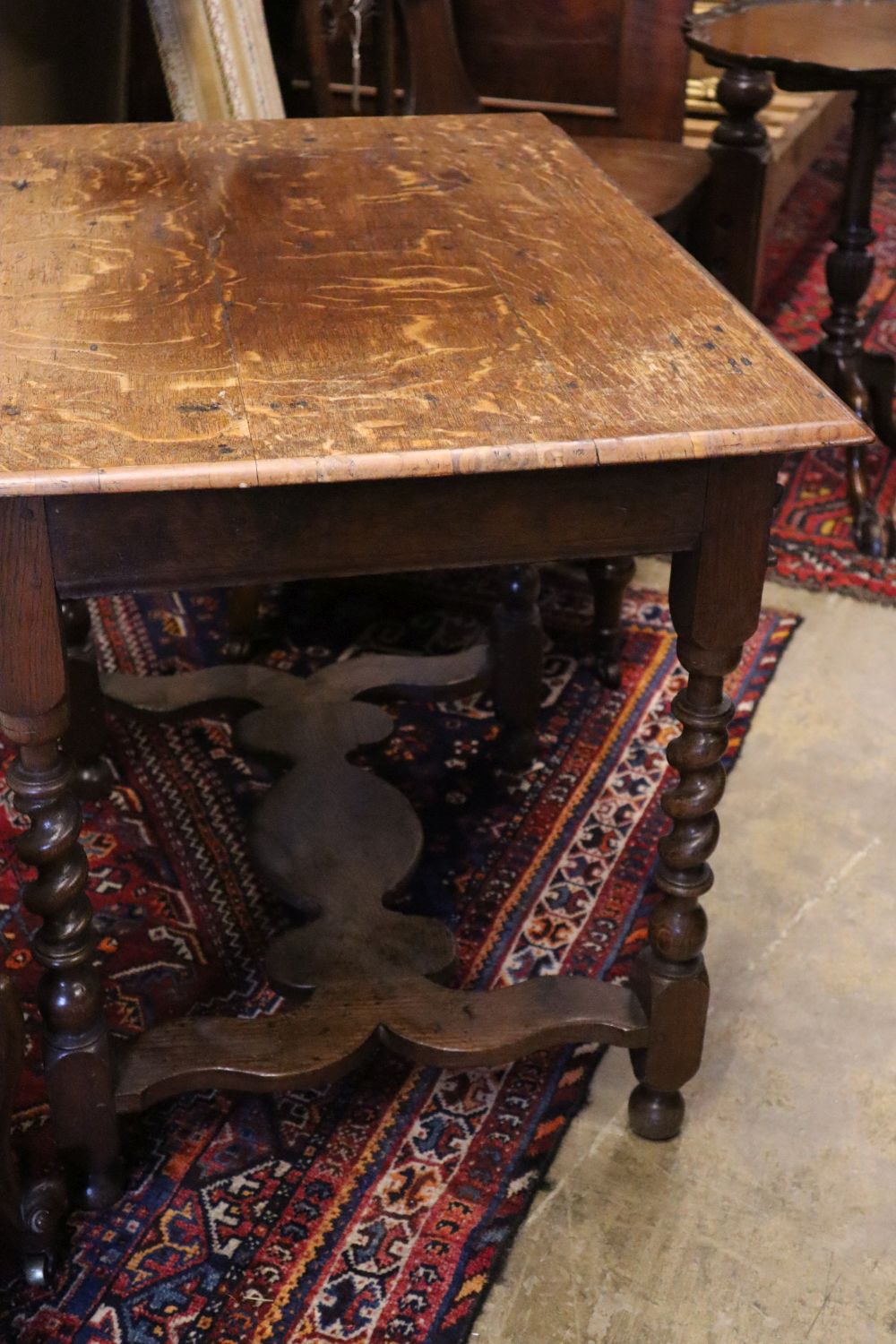 A 17th century and later carved oak side table with spiral-twist supports, width 86cm depth 59cm height 73cm